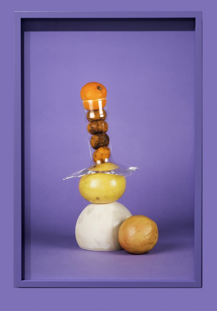 “Citrus, glass and ceramic on purple”
